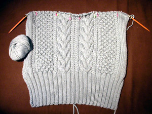 Debbie Bliss Cabled Jacket - the back is ready for raglan shaping