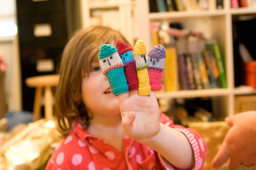 Isabelle with finger puppets